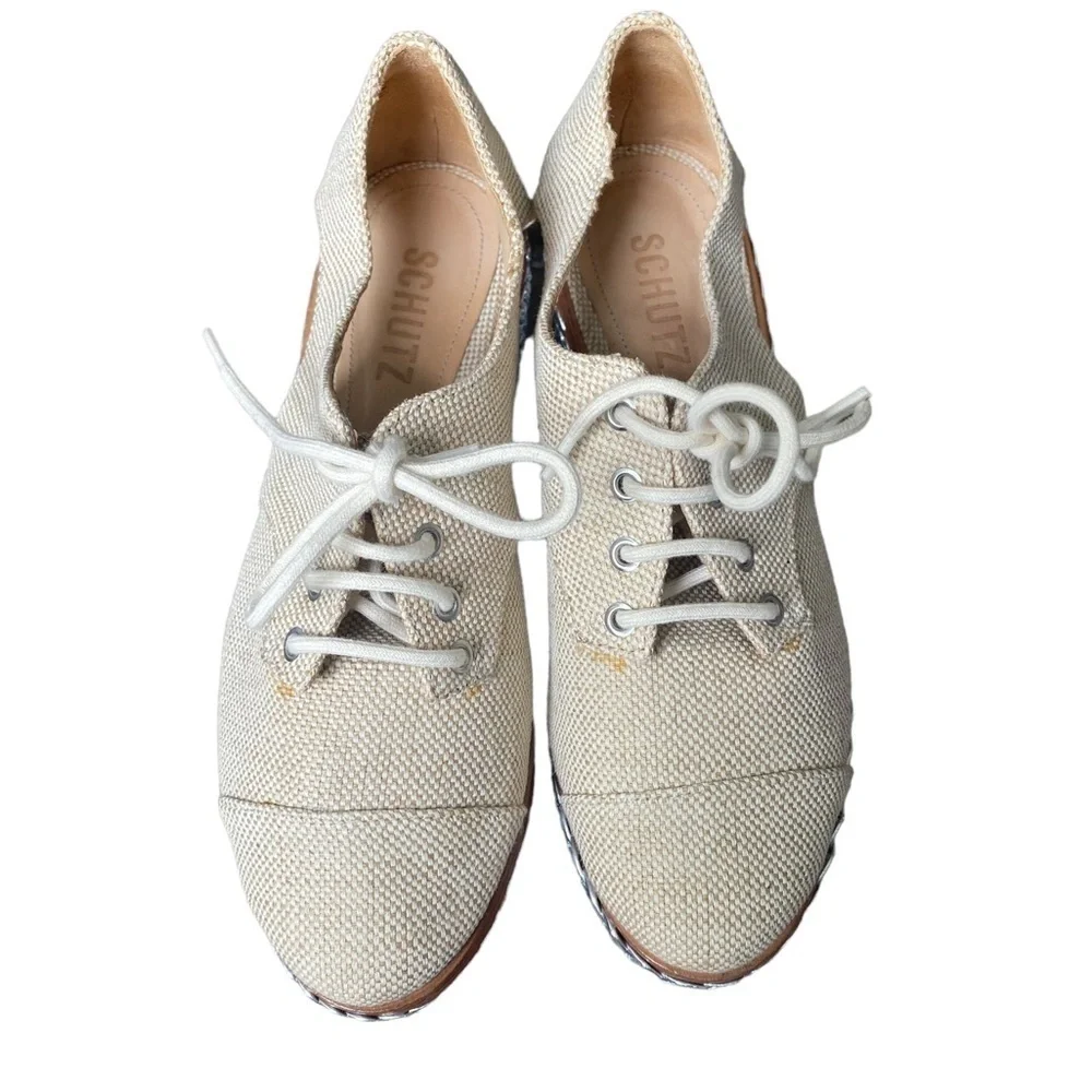 SCHUTZ Cream Lace-Up Platform Wedges with Silver Braided Sole
